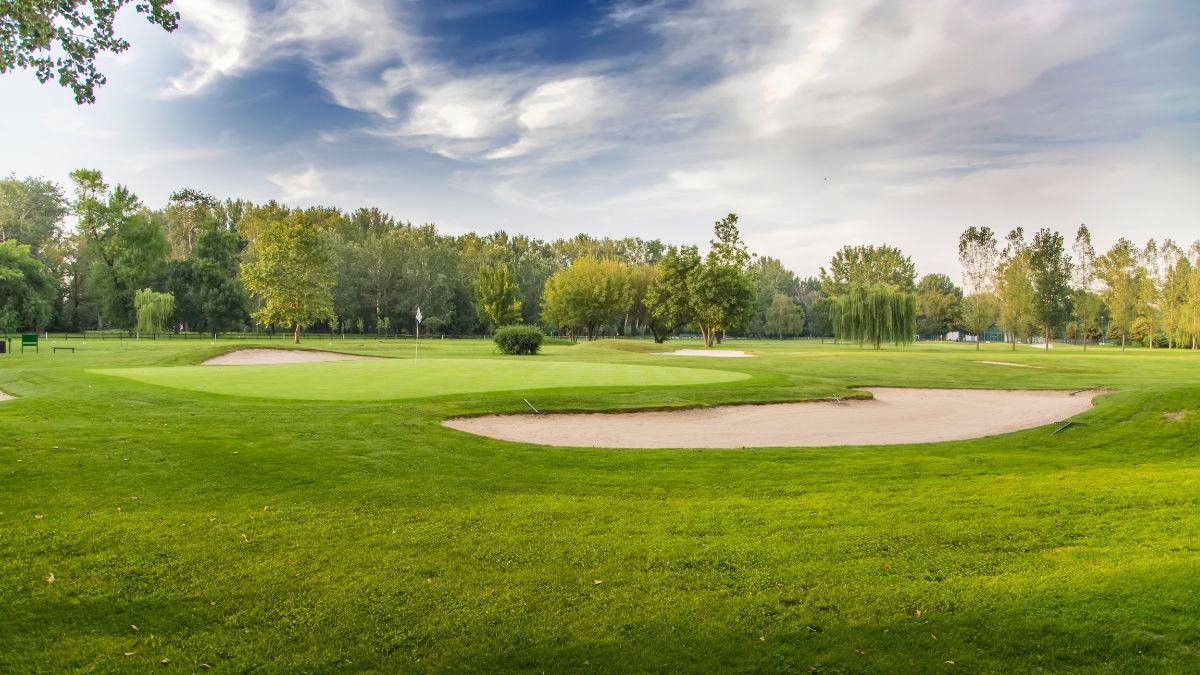 green fairways and sand bunkers at Montgomerie Links Vietnam