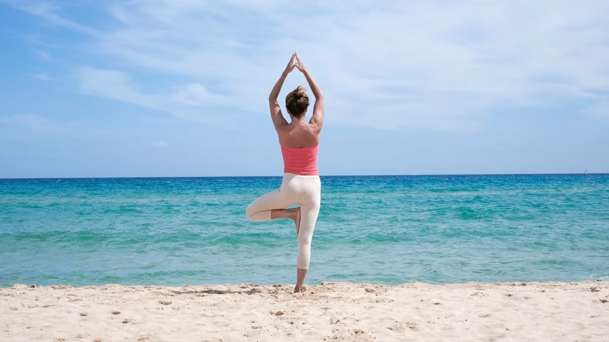 Morning Yoga On The Beach