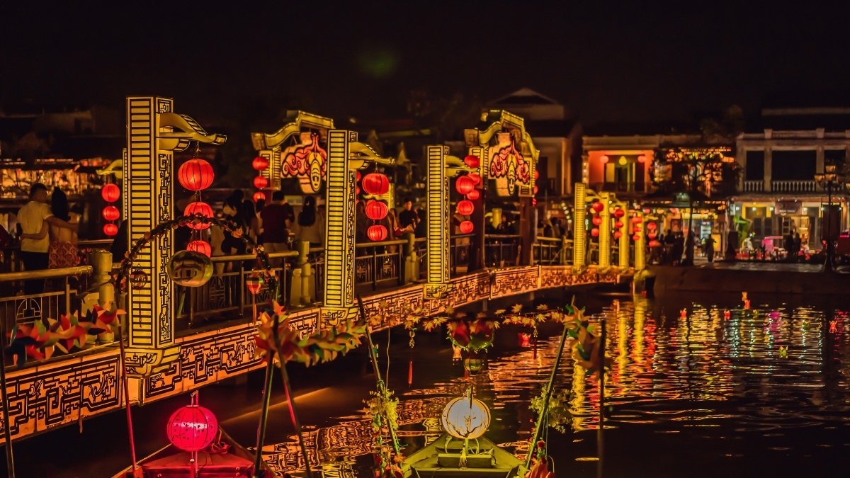 festive lantern bridge scene in holiday program in hoi an